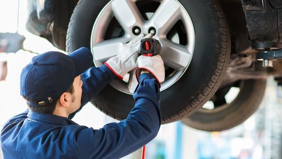 an image of one of our experts having tyres serviced 